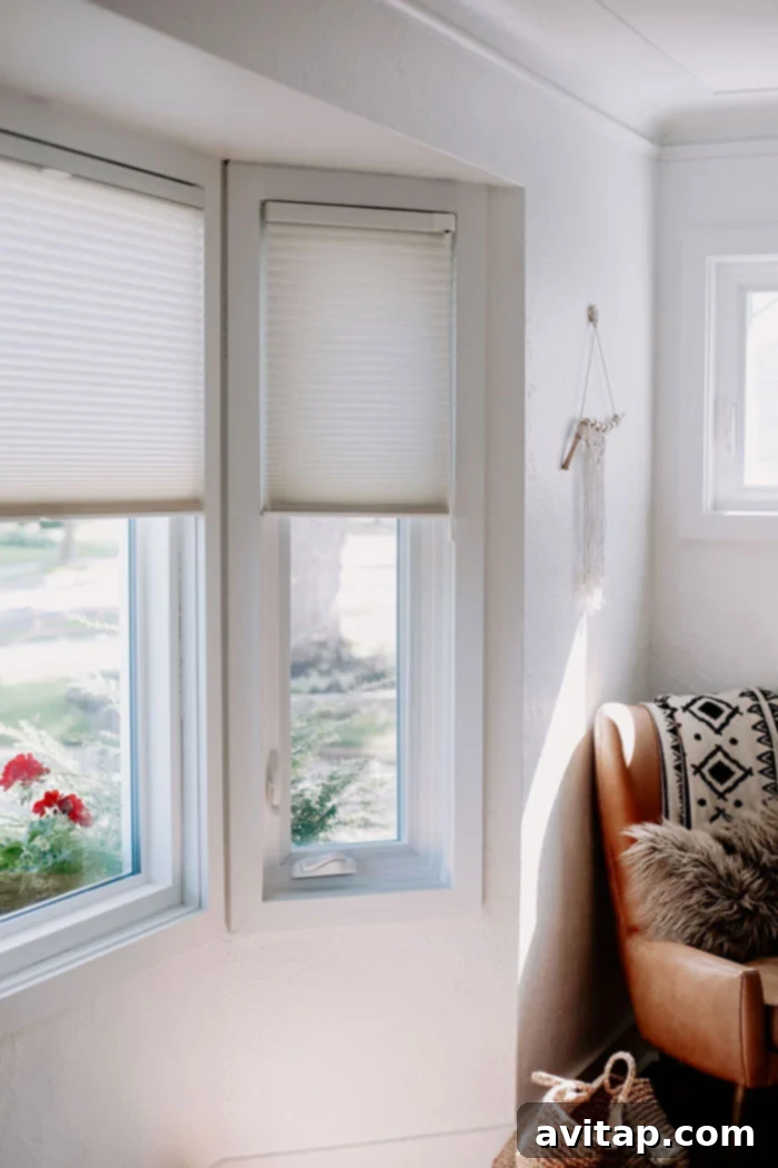 An installed white custom Hunter Douglas blind in a residential window, showing the clean lines and quality craftsmanship of the window treatment.