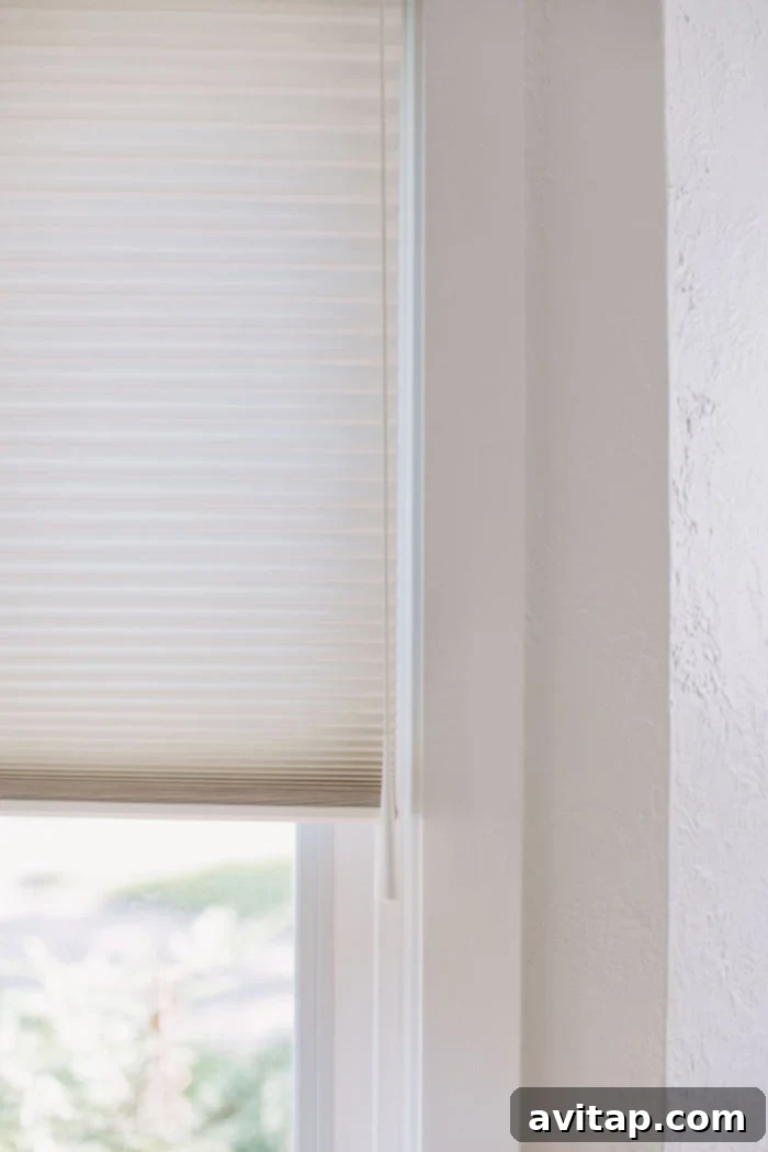 Close-up of a window pull mechanism on a custom Hunter Douglas shade, highlighting its user-friendly design and smooth operation.