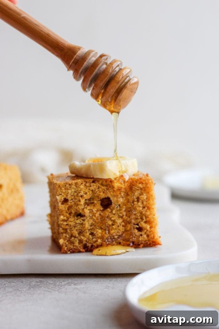 slice of cornbread with honey and butter