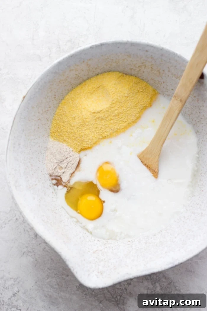 mixed cornbread ingredients in a large bowl