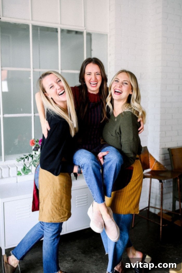 10 Brilliant Friendsgiving Ideas 3 A group of friends laughing and enjoying themselves at a Friendsgiving table, emphasizing the joy and camaraderie of the celebration.
