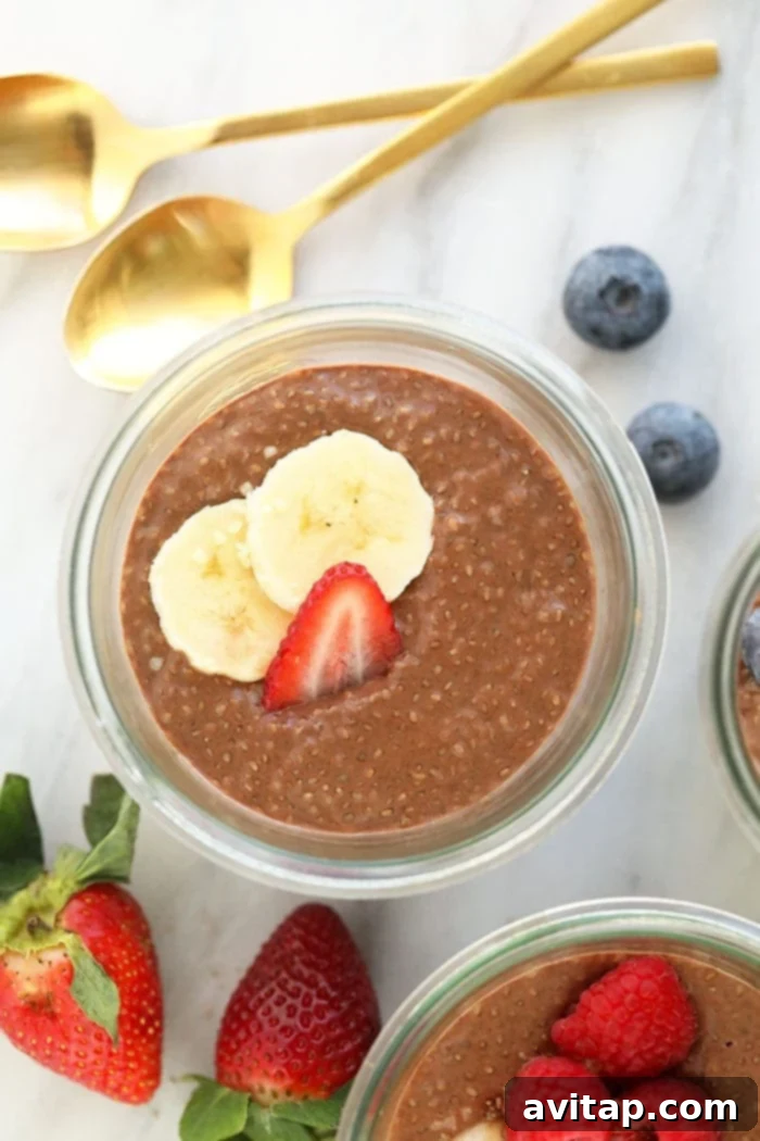 Chia protein pudding in a cup with toppings like berries and nuts, ready for a protein-packed breakfast or snack.