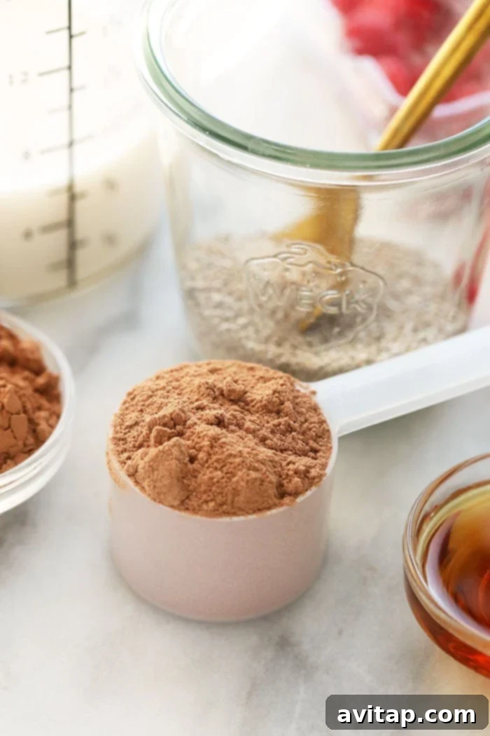 Close-up shot of chocolate protein powder in a measuring scoop.