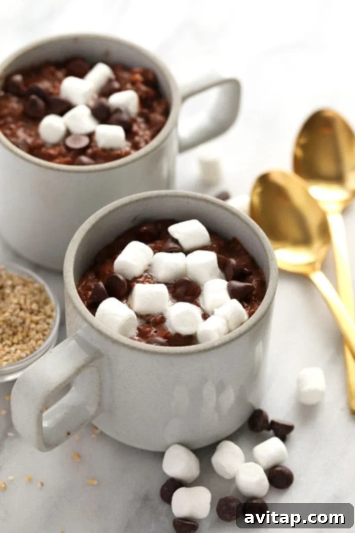 Ready-to-Serve Hot Cocoa Steel Cut Oats in Mugs Several mugs filled with hot cocoa steel cut oats, garnished and ready to be served.