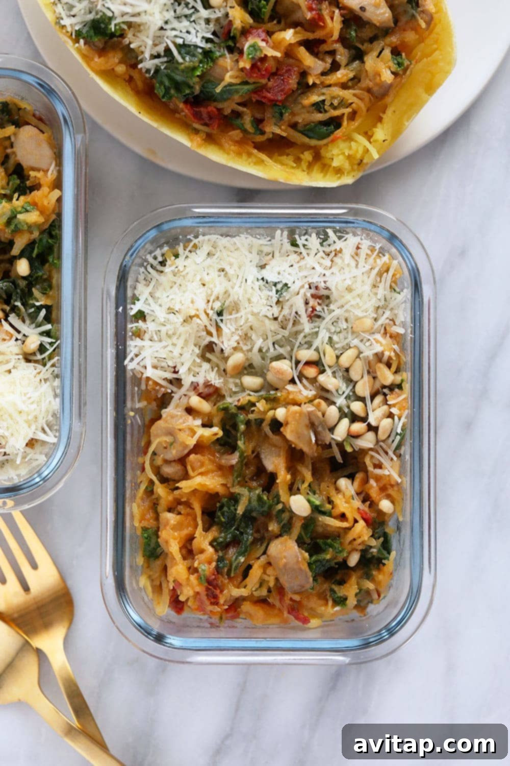 Stuffed spaghetti squash perfectly portioned in a clear meal prep container, ready for the week.