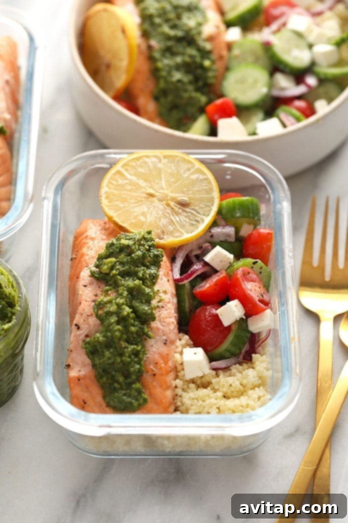 Mediterranean Salmon Meal Prep in glass container with pesto and salad