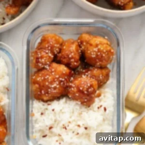 General Tso's Cauliflower in a meal prep container, ready to be stored or eaten.
