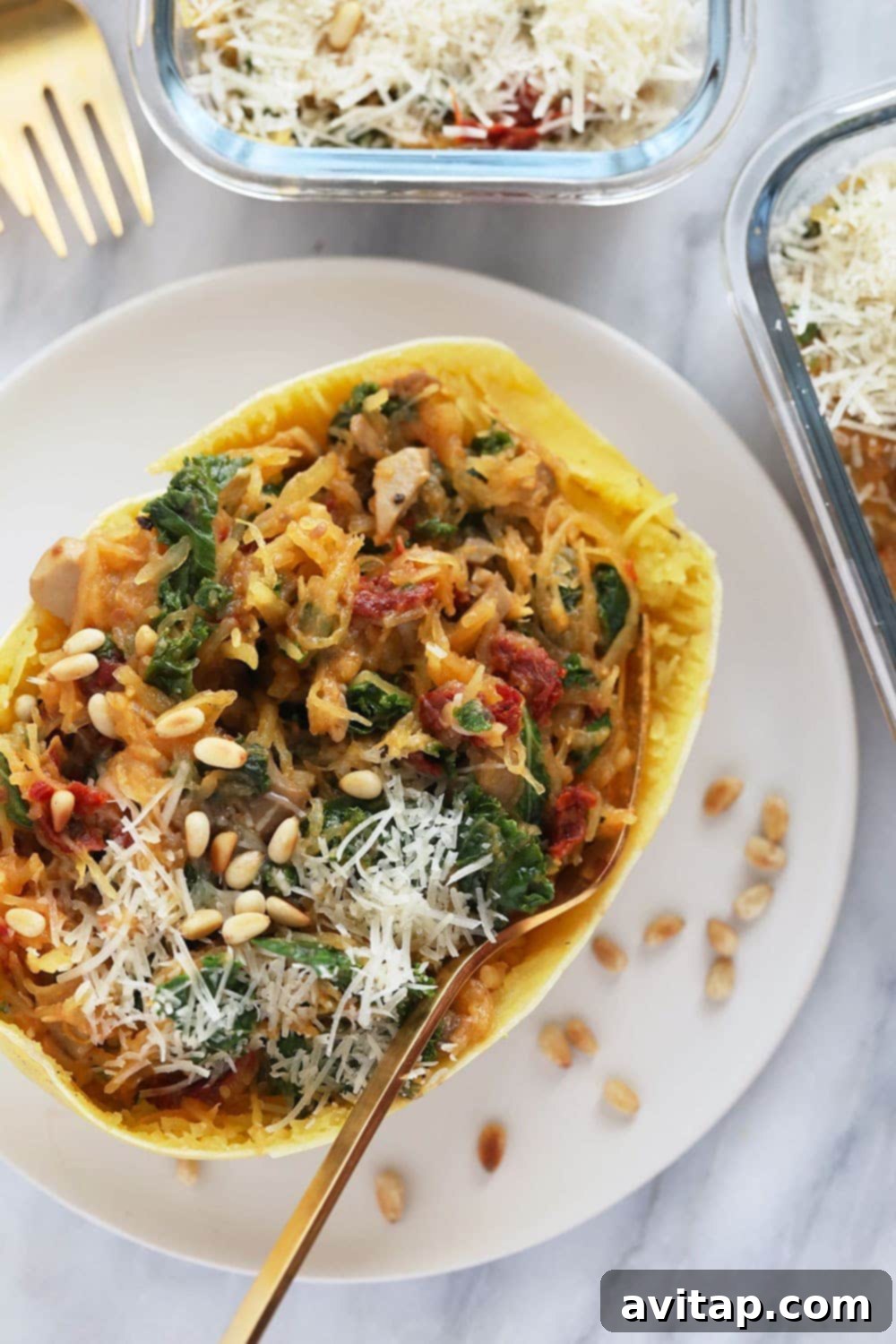 Instant Pot Stuffed Spaghetti Squash on a plate, garnished with fresh herbs