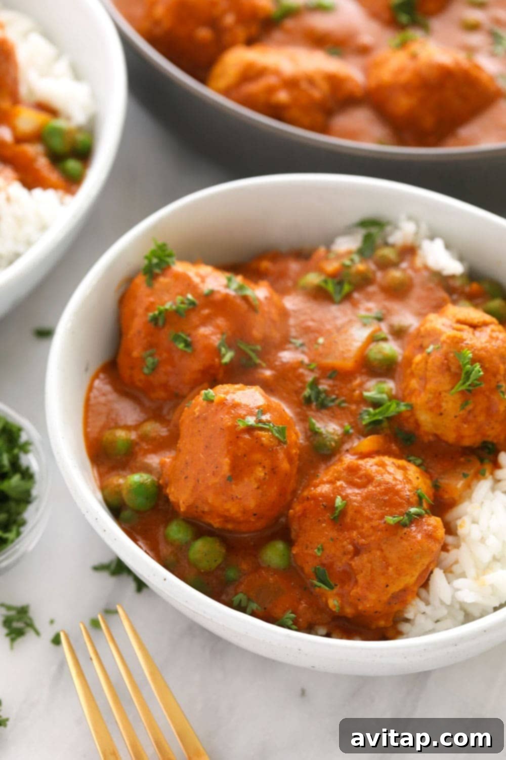Hello, tikka masala meatballs! Enjoy a bowl of these tikka masala meatballs over a bed of rice, quinoa, or roasted veggies! You can make it for dinner or for a great meal prep dinner for the week! Tikka masala meatballs over rice