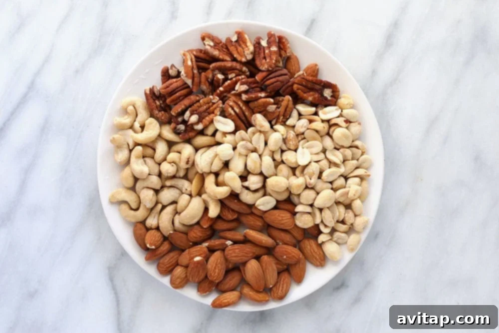 A rustic wooden plate filled with a variety of nuts including almonds, walnuts, and cashews, ready for snacking or blending.