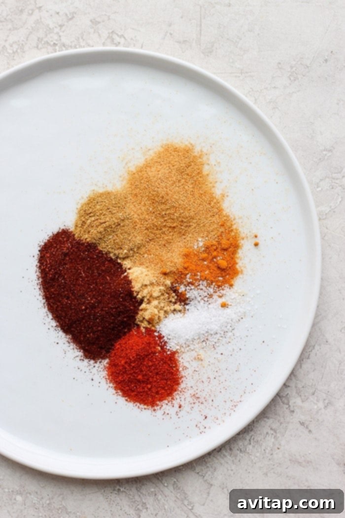 Moroccan spices on a plate, showcasing a vibrant orange hue and rich texture