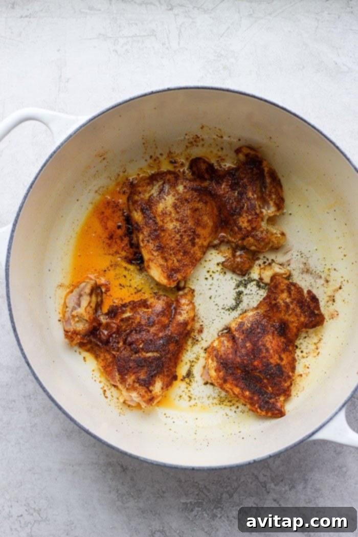 Sautéed Moroccan chicken thighs, garnished with fresh herbs and ready to serve