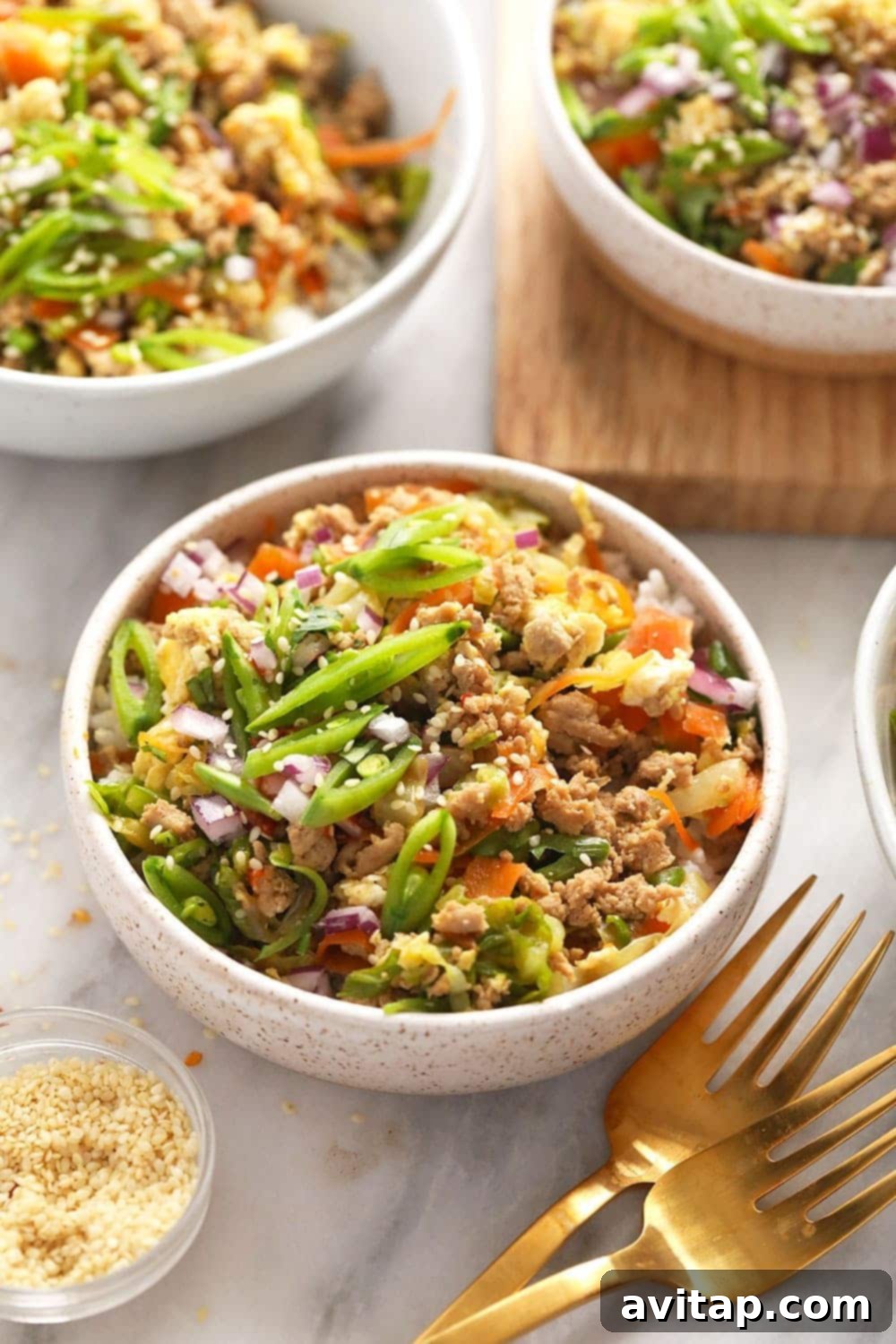 egg roll in a bowl served with rice