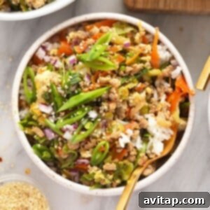 egg roll in a bowl served with rice
