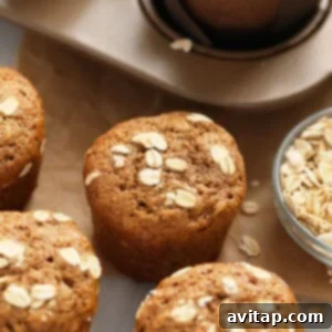 Finished Classic Oatmeal Muffins, golden brown and topped with oats