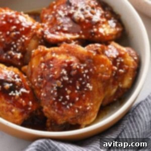 Honey garlic sesame chicken in a bowl, ready to serve.