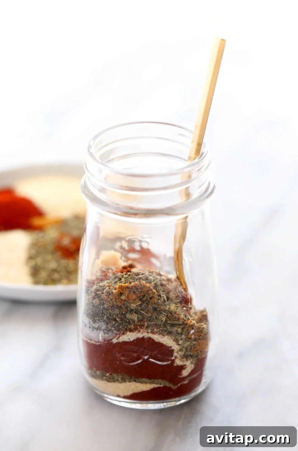 Homemade Cajun Seasoning in a spice jar, ready to use in the kitchen.