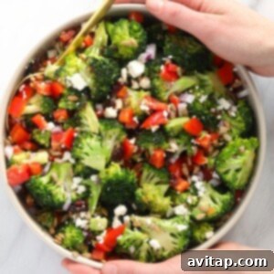 Finished broccoli salad in a stylish white bowl, ready for serving