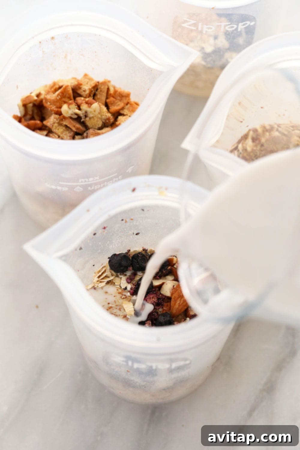 Instant Oatmeal - Ready to Serve Four bowls of instant oatmeal with different toppings and milk being poured over one, highlighting versatility.
