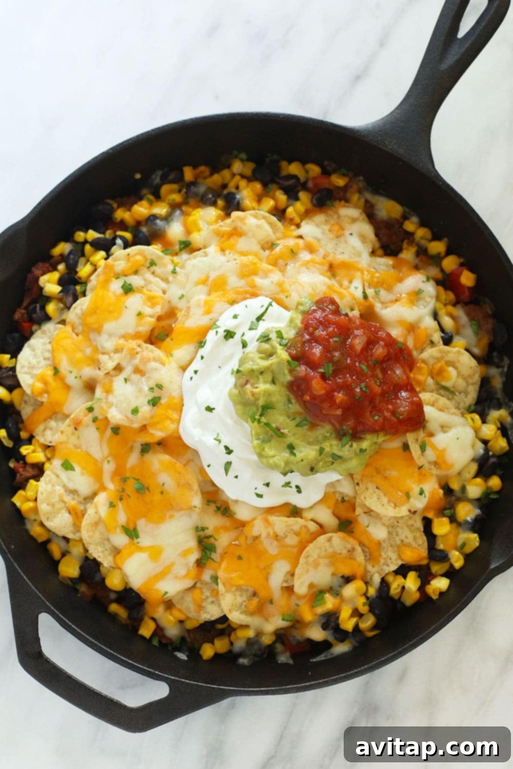 Easy taco casserole in a cast iron skillet, ready to be served