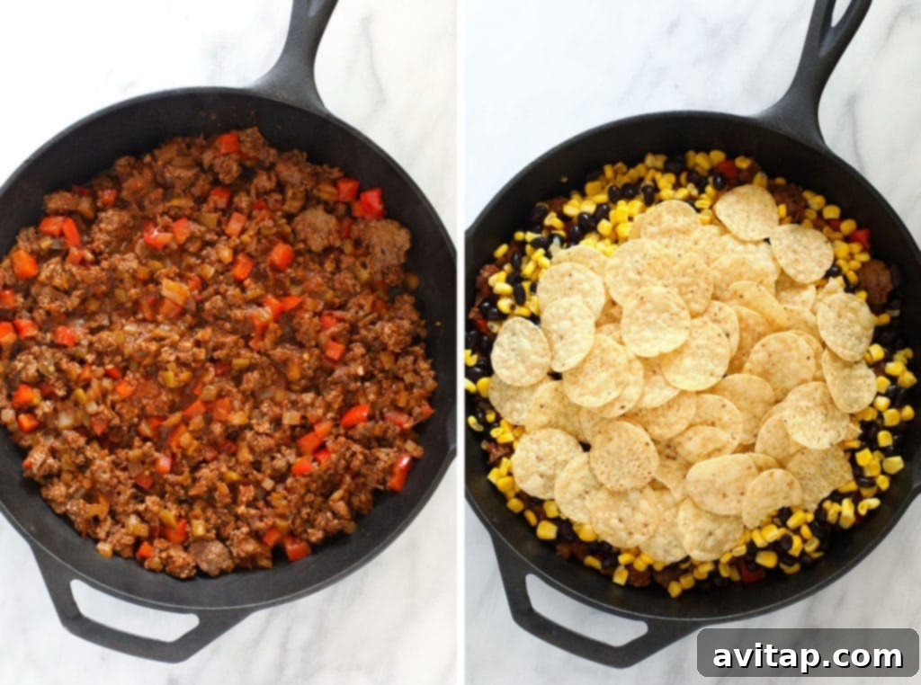 All the ingredients for an easy taco casserole layered in a cast iron skillet before baking