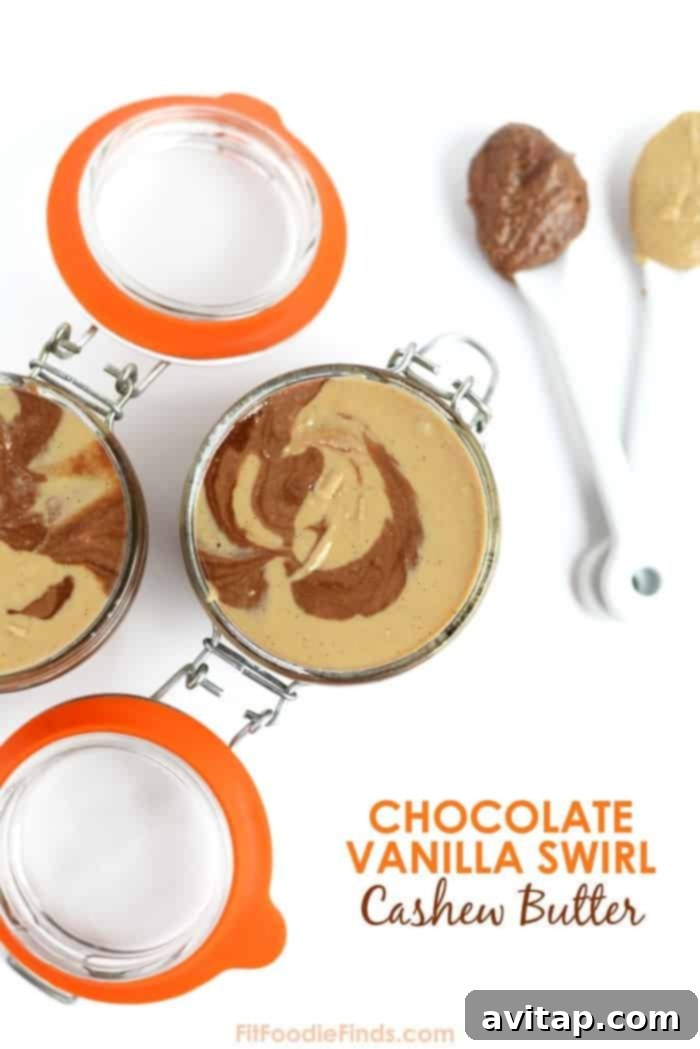 A jar of homemade Chocolate Vanilla Swirl Cashew Butter showcasing distinct chocolate and vanilla layers beautifully swirled together. Perfect for spreading or dipping.