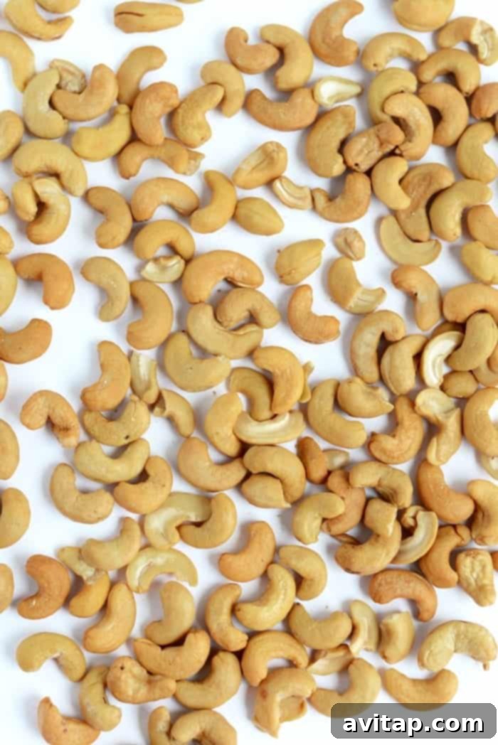 A bowl of whole, perfectly roasted cashews, ready to be transformed into creamy, delicious cashew butter.