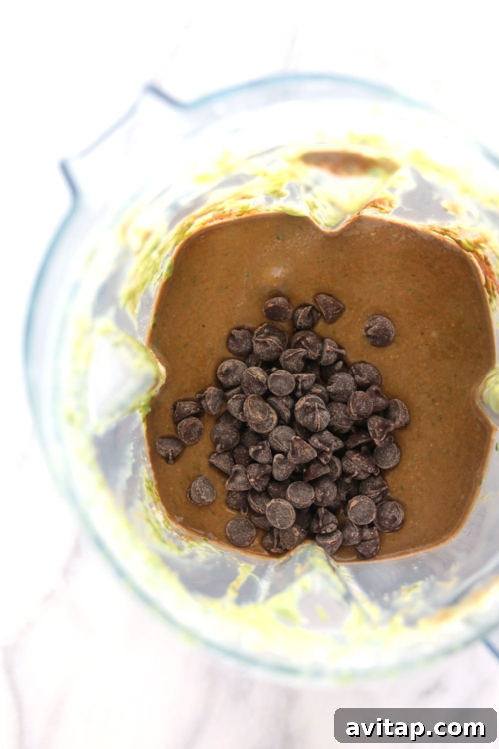 All ingredients in the blender for an easy muffin recipe All ingredients loaded into a blender, ready to be pulsed into muffin batter.