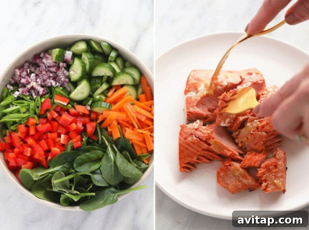 A vibrant plate featuring perfectly cooked miso-ginger salmon fillets alongside a fresh, colorful Thai salad brimming with vegetables and cashews.