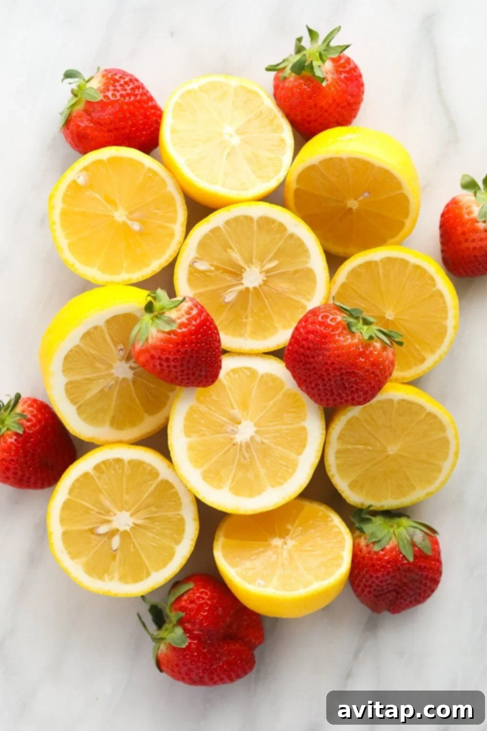 This Strawberry Vodka Lemonade is made with fresh strawberry puree, fresh squeezed lemons and a honey simple syrup, plus vodka, of course! Get ready for your new favorite homemade cocktail. Fresh lemons and strawberries, vibrant and ready to be transformed into a delicious strawberry vodka lemonade.