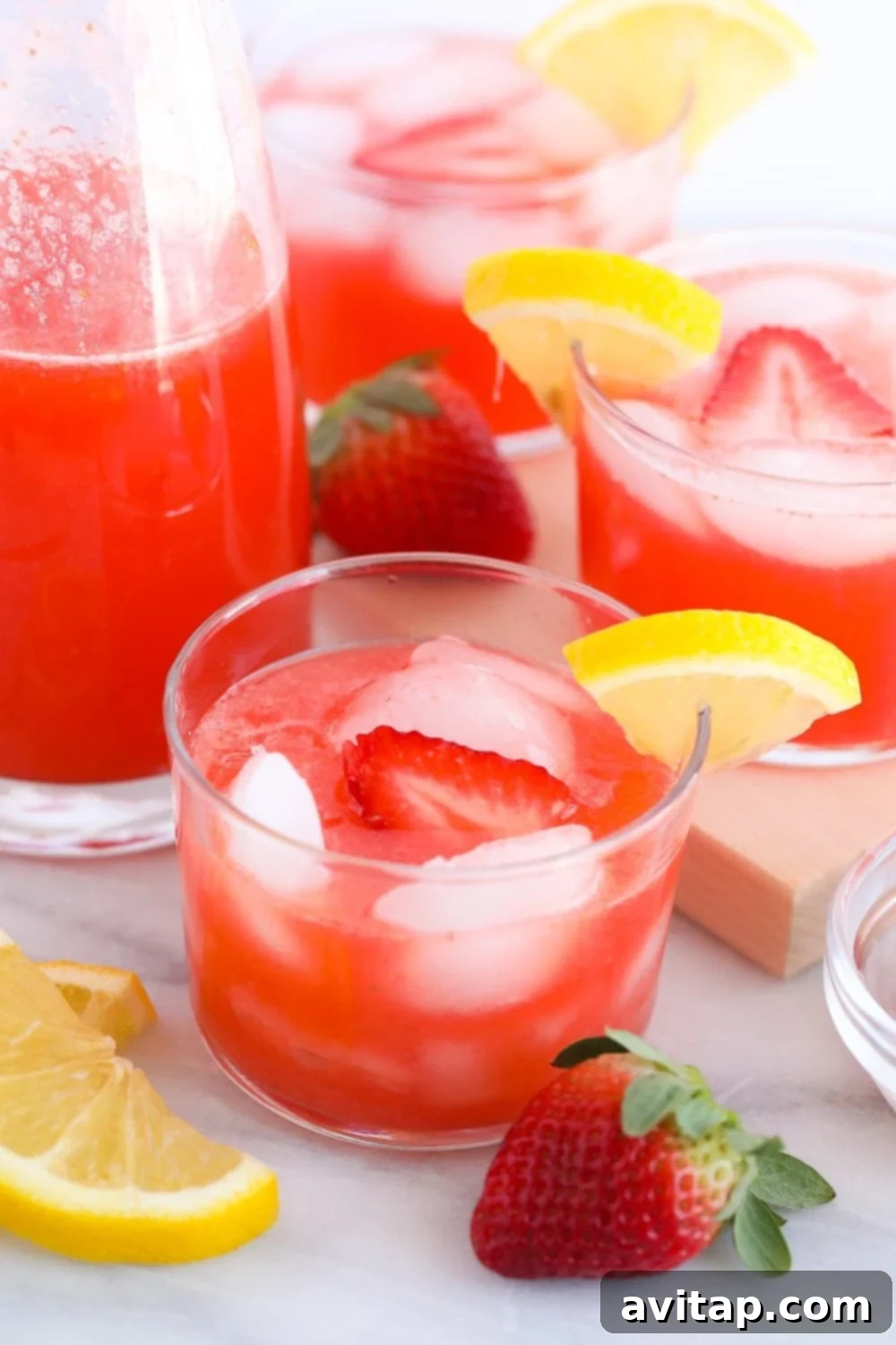 This Strawberry Vodka Lemonade is made with fresh strawberry puree, fresh squeezed lemons and a honey simple syrup, plus vodka, of course! Get ready for your new favorite homemade cocktail. A delicious glass of strawberry vodka lemonade, beautifully garnished and ready to be enjoyed.