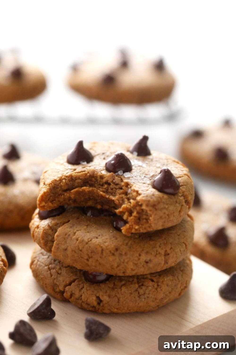 Stack of three freshly baked peanut butter protein cookies