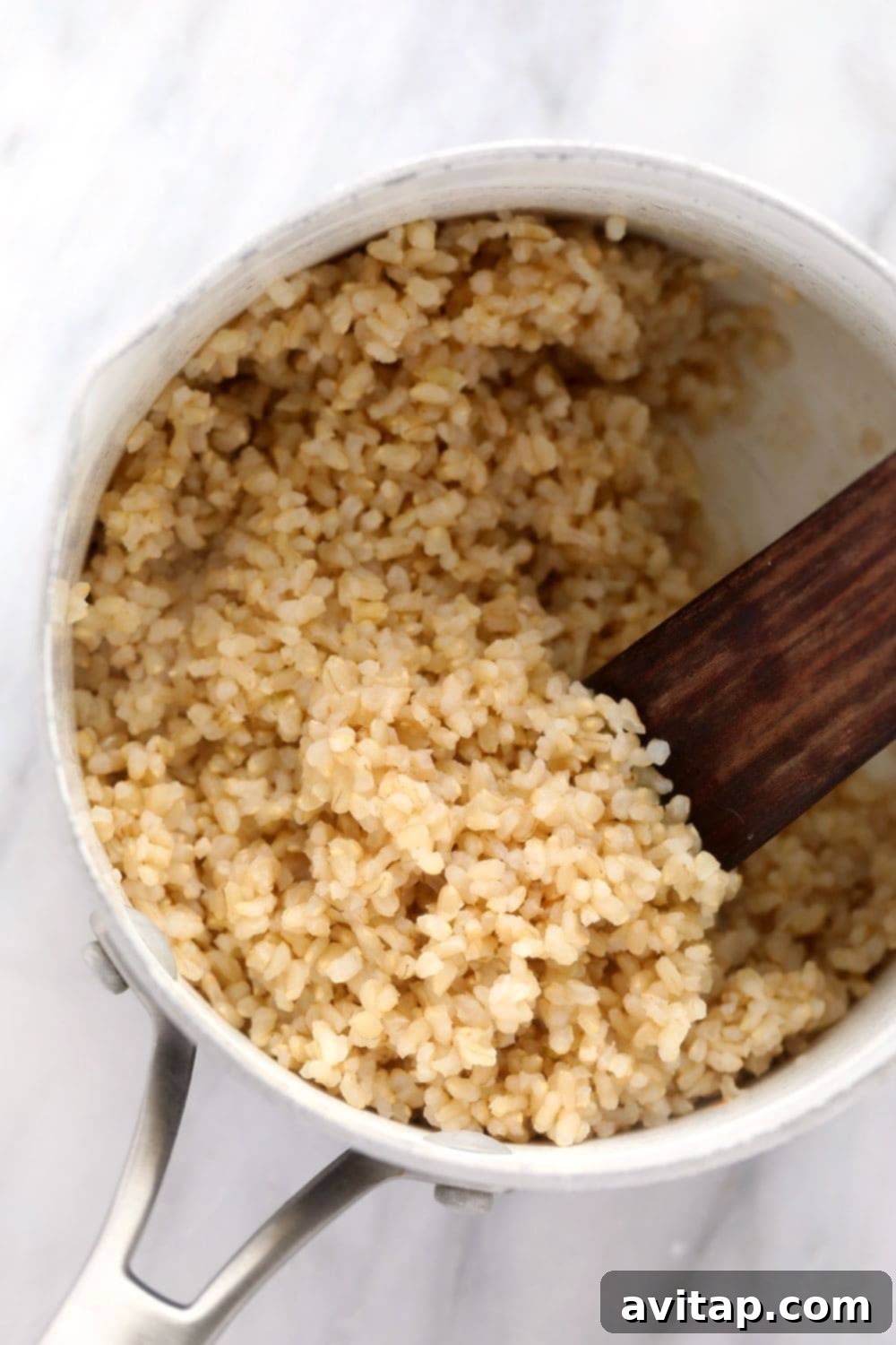 Close-up of fluffy short-grain brown rice, a key component of the vegetarian brown rice bowl