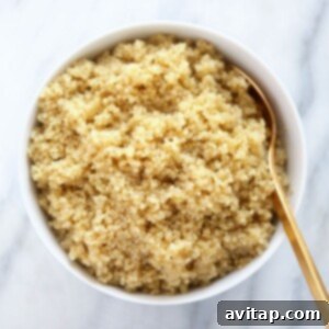A guide on how to make quinoa served in a white bowl with a gold spoon.