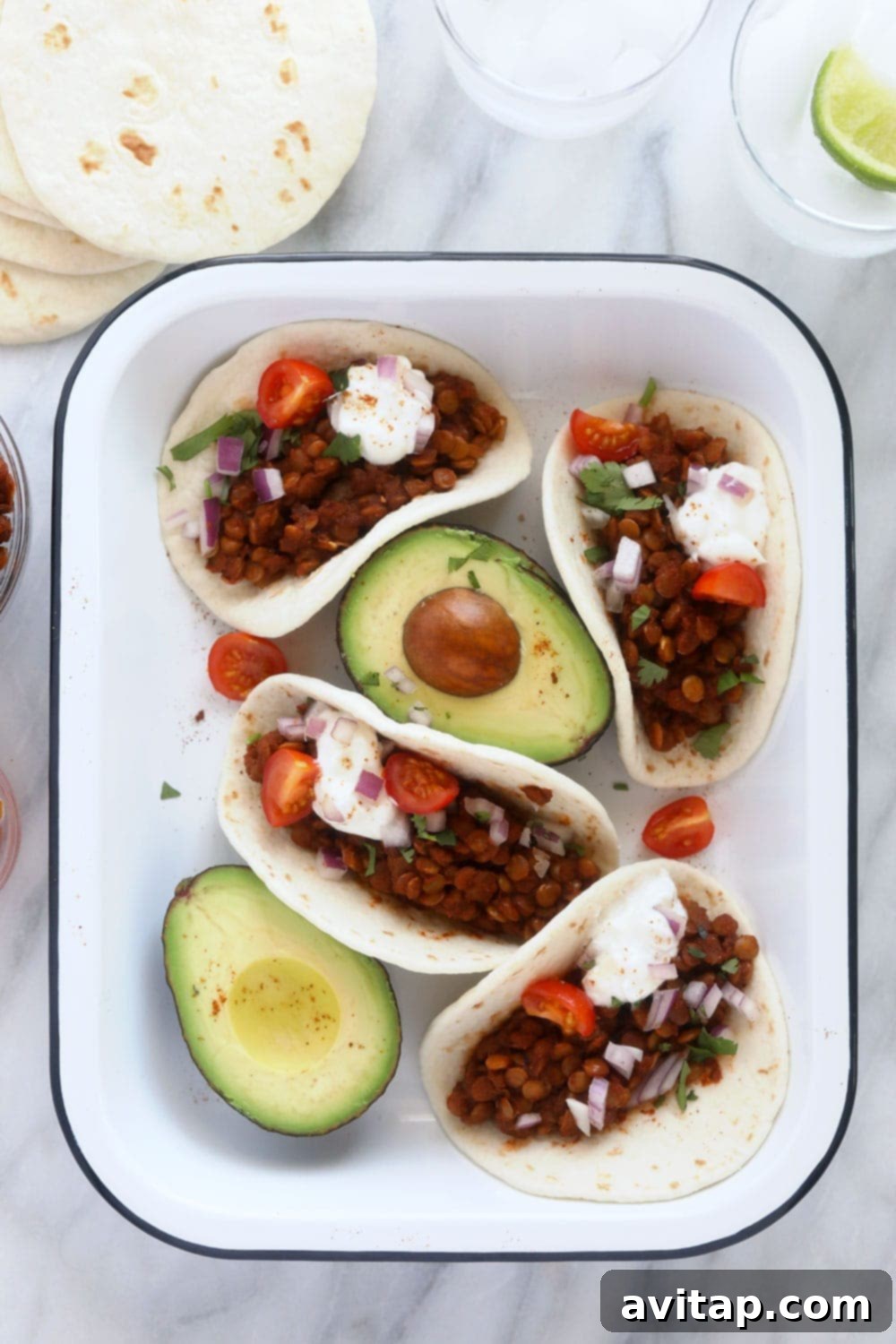 A vibrant platter of Instant Pot Lentil Tacos with fresh toppings, ready to be enjoyed.