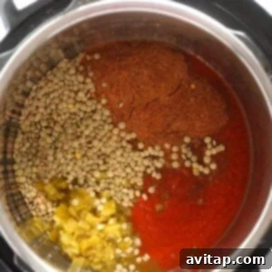 An Instant Pot filled with lentils and spices for making delicious lentil tacos.