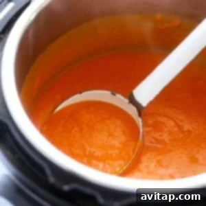 Creamy Instant Pot Tomato Soup being blended until smooth.