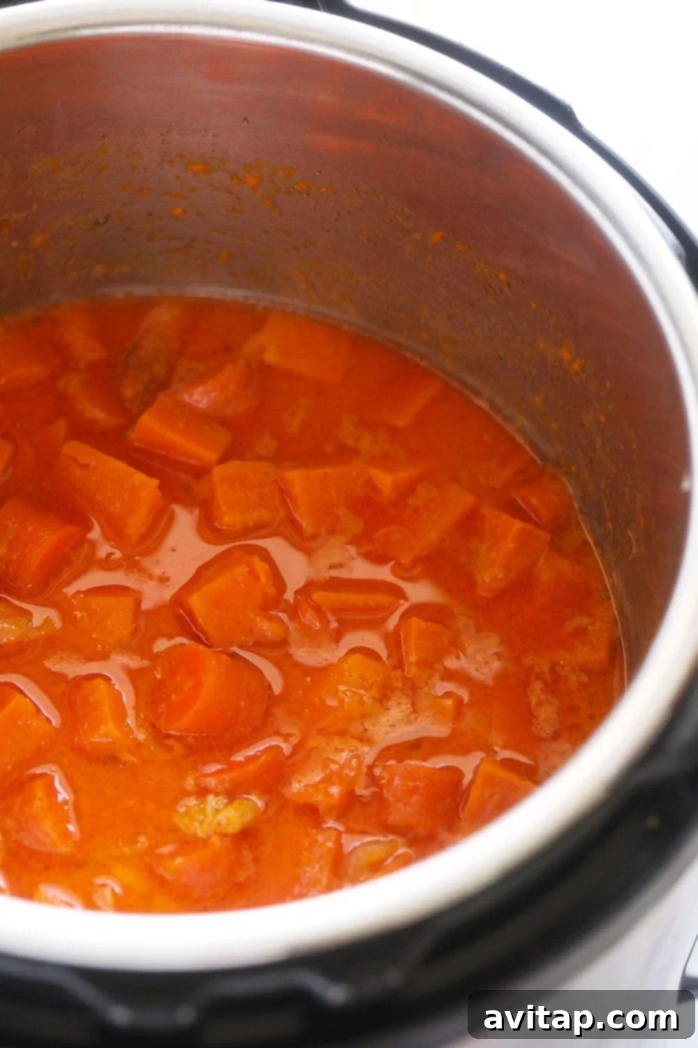 Instant Pot sweet potato carrot ginger soup ingredients, cooked and ready to be blended.