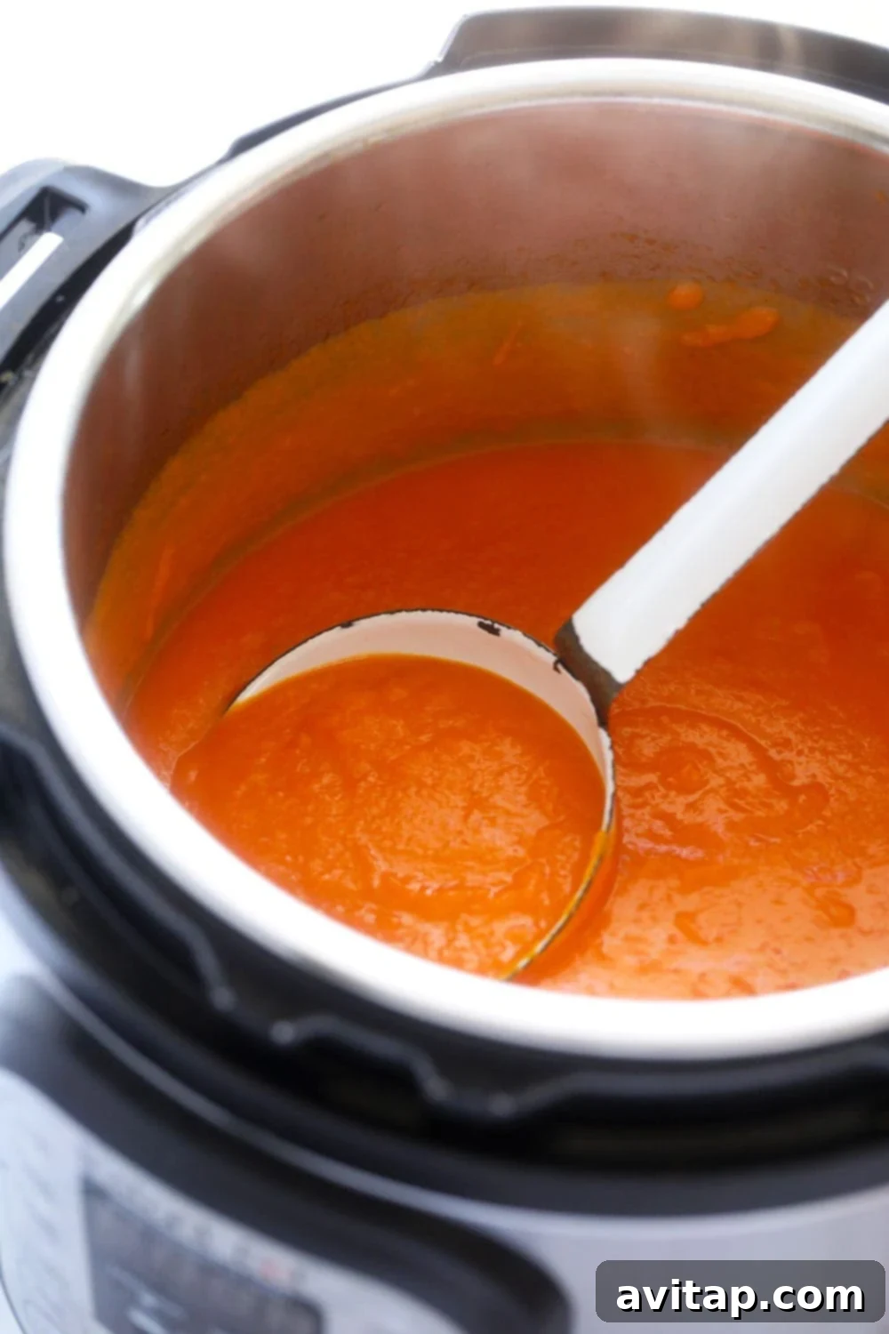 Sweet potato carrot ginger soup smoothly blended in the Instant Pot, ready to be served.
