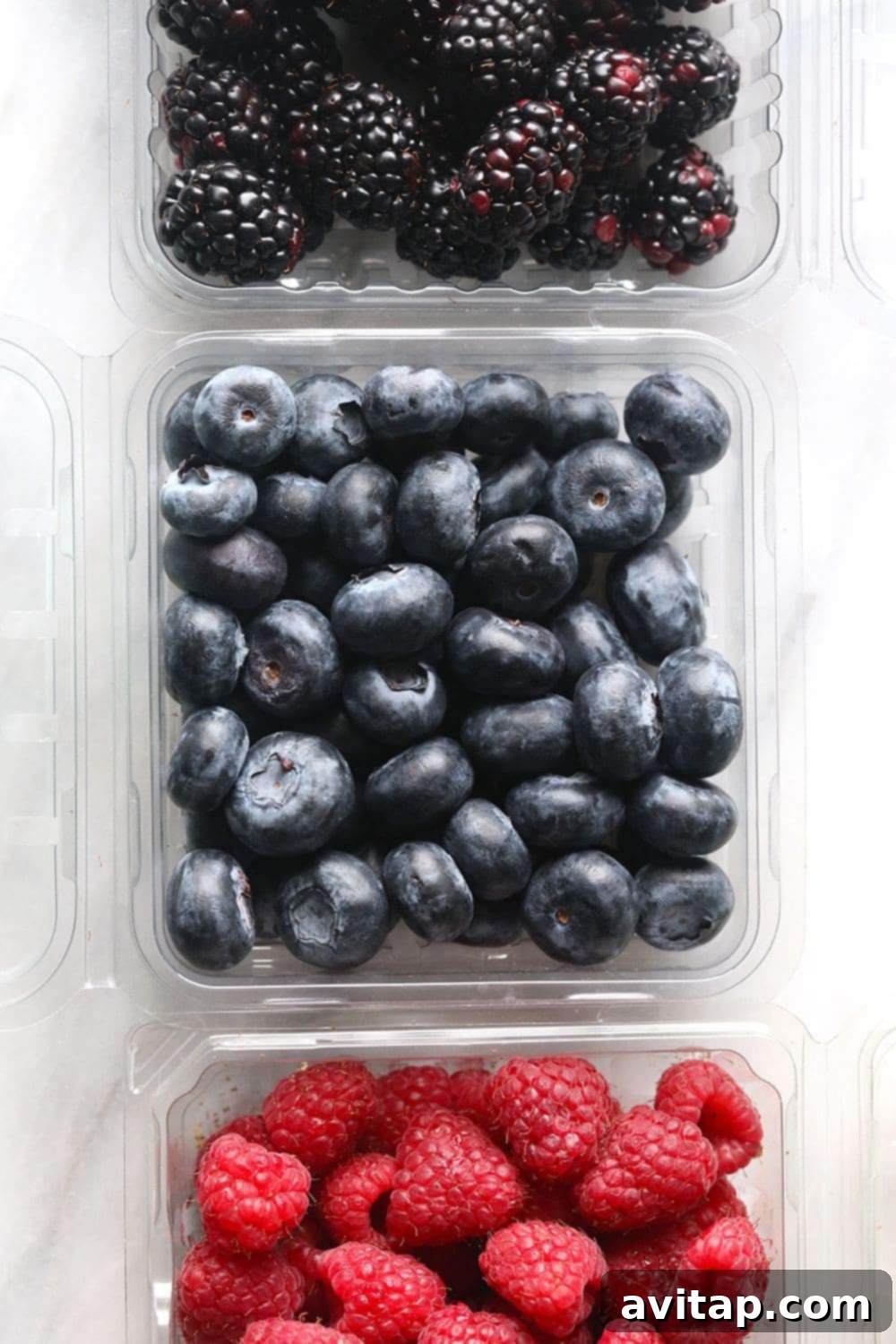 Fresh Mixed Berries for Healthy Breakfast Bread A vibrant assortment of fresh blackberries, strawberries, raspberries, and blueberries ready for baking.