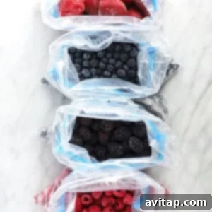 Triple Berry Morning Loaf 2 Three bags of frozen berries, showcasing different varieties.
