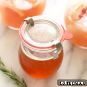 Tropical Strawberry Escape 2 honey simple syrup in jar.
