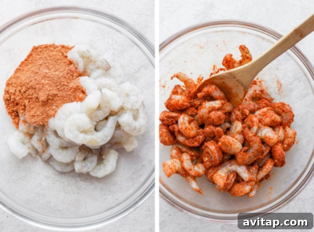 Raw shrimp being generously coated in a vibrant taco seasoning, ready for cooking