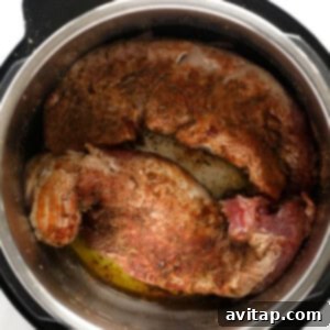 Searing the pork tenderloin in the Instant Pot.