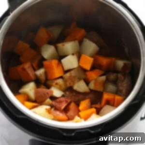 Potatoes cooking in the Instant Pot alongside the pork.