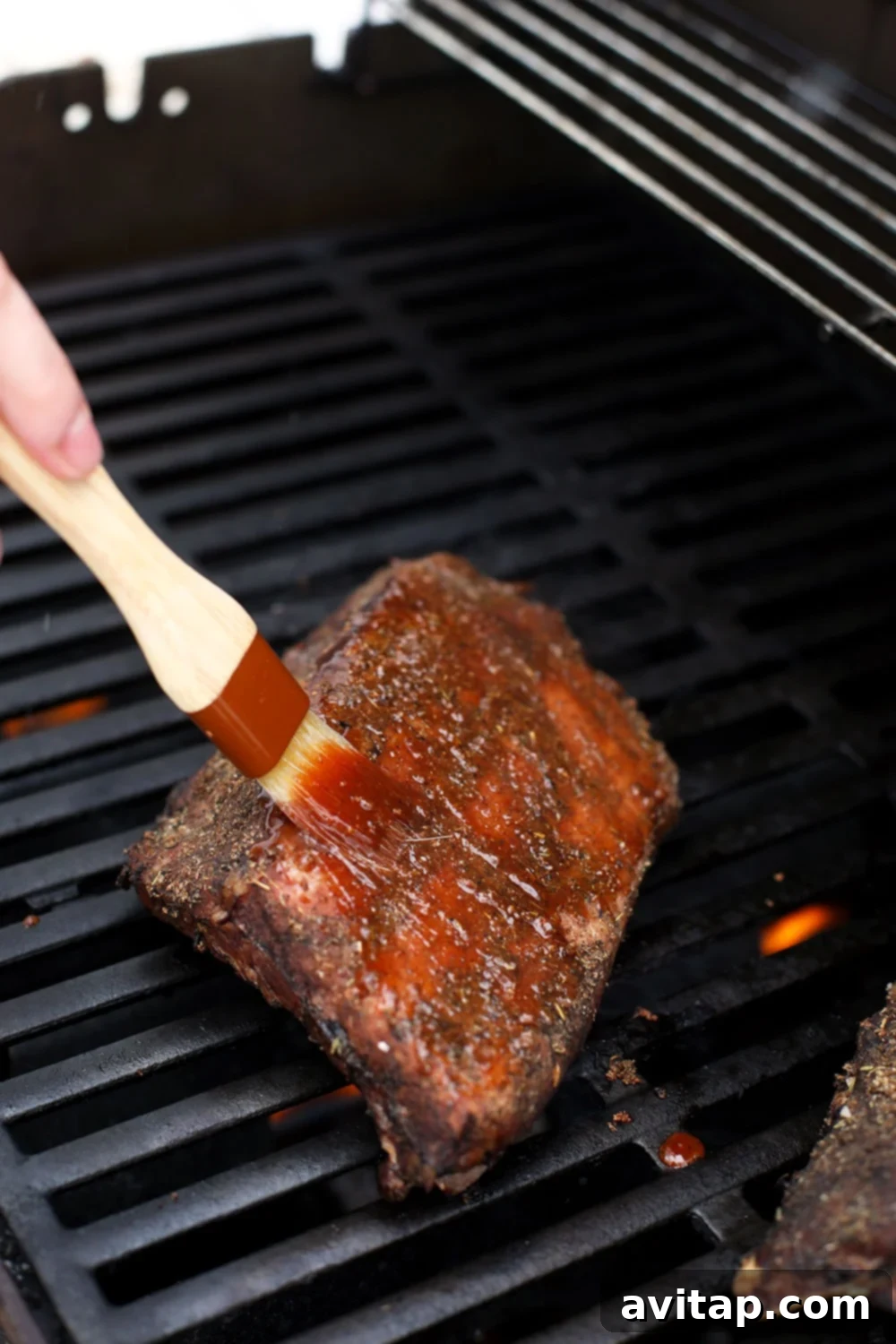 Brushing the sous vide ribs with bbq sauce. 