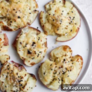 Smashed red potatoes on a plate ready to serve.