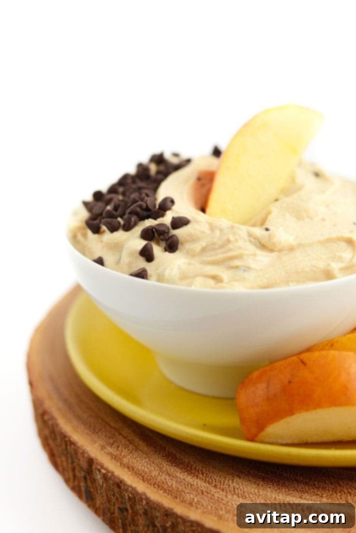 Creamy peanut butter Greek yogurt dip with chocolate chips in a bowl