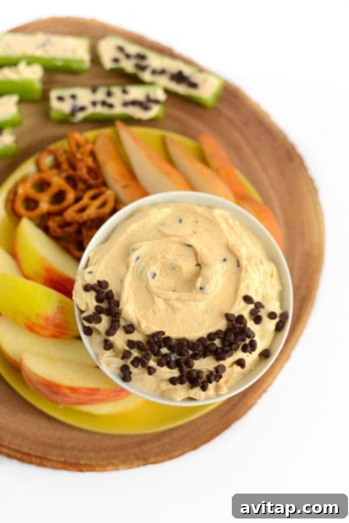 Peanut butter Greek yogurt dip served with a variety of fruits and pretzels