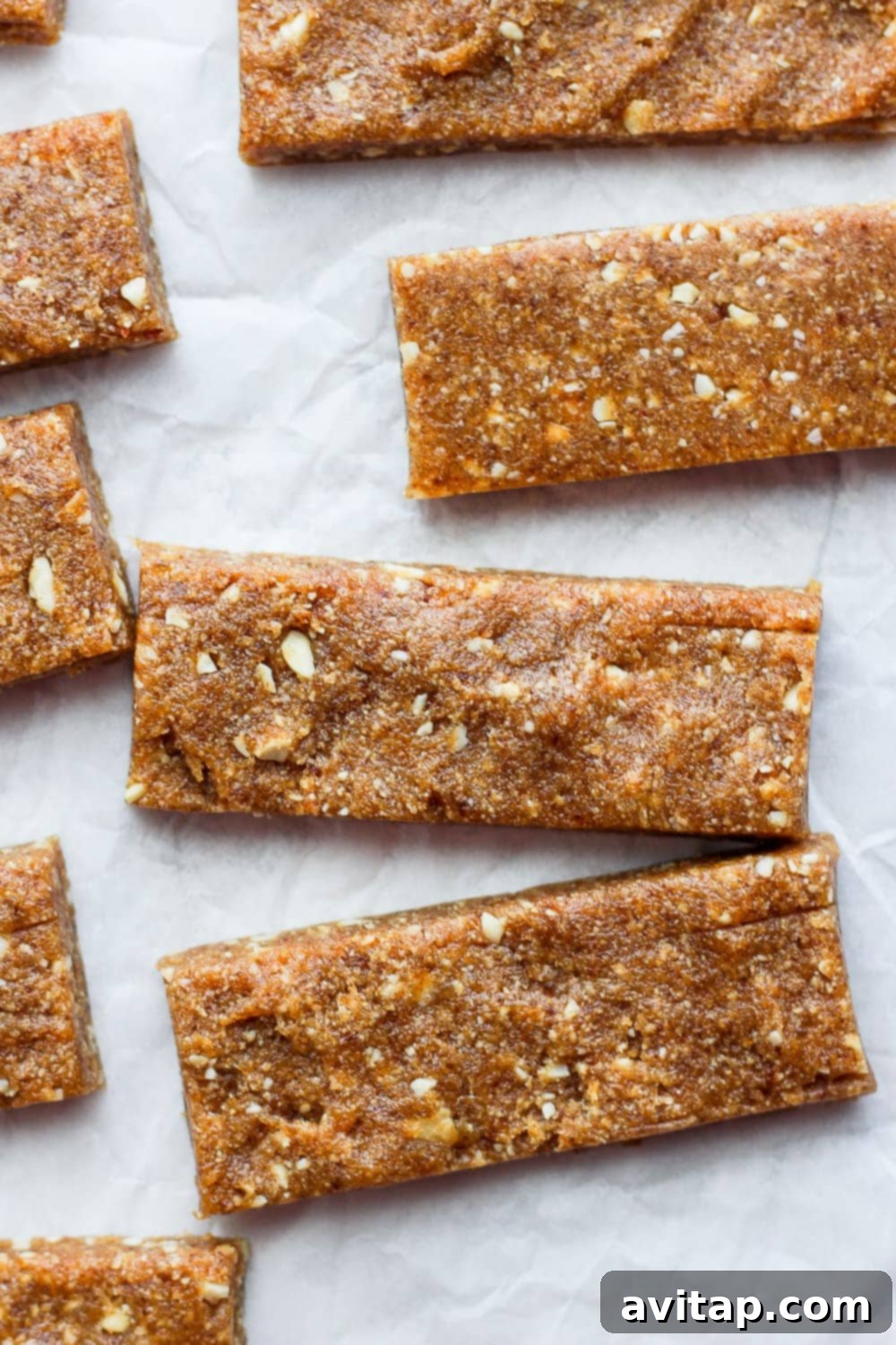Homemade Copycat Cashew Cookie Larabars: A 3-Ingredient Grain-Free, Vegan Snack Homemade Copycat Cashew Cookie Larabars on parchment paper, ready to be enjoyed as a healthy snack.